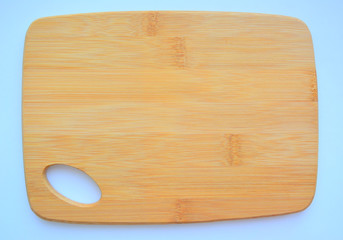 wooden cutting board isolated on blue background