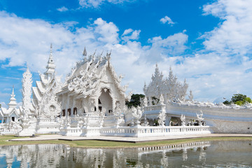 Wat Rong Khun (White temple) in Chiangrai, Thailand during summer time.