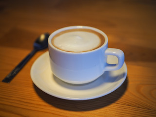 cup of coffee on wooden table