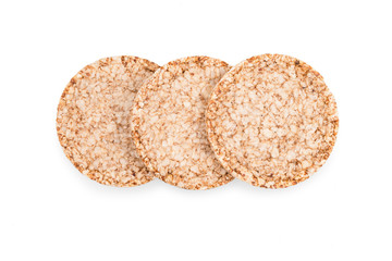 Three round wheat airy crispbread. Isolated on white background. Top view