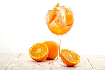 glass of aperol spritz cocktail on white background