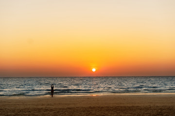 Fototapeta premium girl doing yoga at sunrise