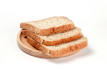Toast wheat bread sliced on wooden plate isolated on white background