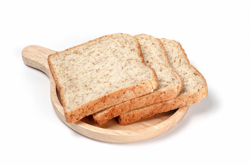 Whole wheat bread. Whole Grain Bread. Toast wheat bread sliced on wooden plate isolated on white background