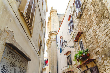 Bari, Italy - March 8, 2019: Labyrinthine alleyways in the old town of the Italian city of Bari, next to the Adriatic.