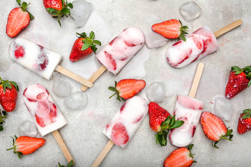 Fruit popsicle with frozen strawberry and yogurt, ice cream on stick