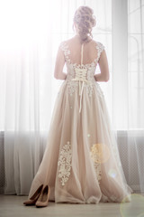 Fototapeta na wymiar Cream bridesmaid dress. Wedding Dress. Holiday dress.