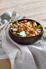 Chickpea salad with vegetables and microgreens
