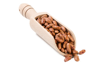  Pinto bean in wooden scoop isolated on white background. nutrition. bio. natural food ingredient.