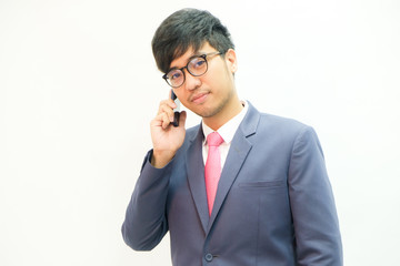 Business asian men use samrtphone in suit cloth with tie