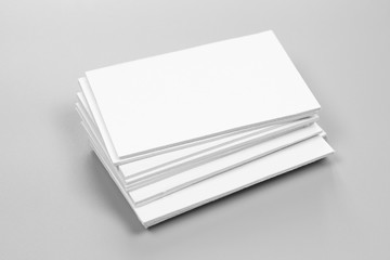 Blank portrait mock-up paper. brochure magazine isolated on gray, changeable background / white paper isolated on gray cement backdrop.