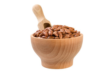Pinto bean in wooden bowl and scoop isolated on white background. nutrition. bio. natural food ingredient.