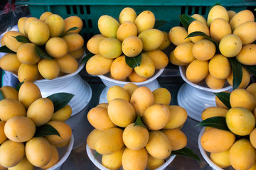 Marian plum or gandaria or plum mango on stall for sell at local shop in Thailand
