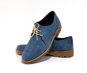 Blue suede men shoes isolated on a white background. Fashion advertising shoes photos.