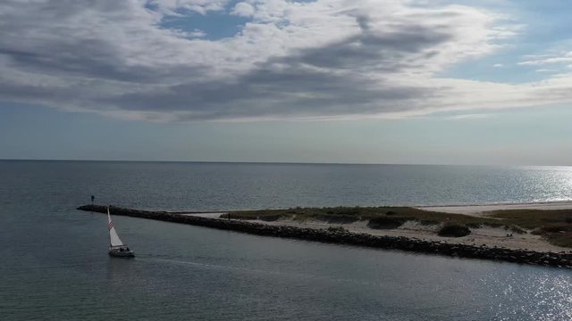 Sailboat Leaving Harbor