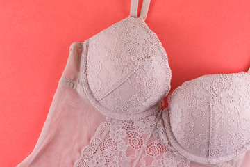 Pink bra on pink background.