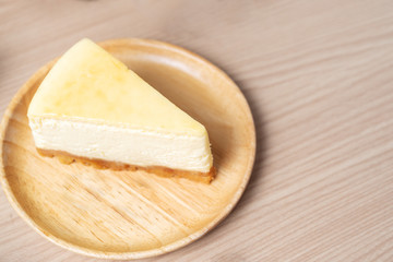 Homemade Cheese cake or butter cake put on wooden plate or dish and place on table.