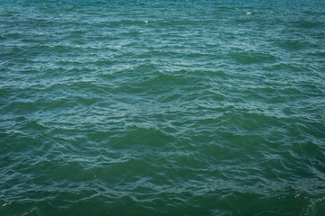 boundless blue sea the waves beat on the pier infinitely turquoise water ripples