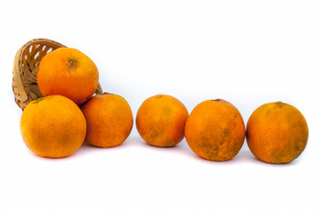 Fruit basket full of raw organic fresh oranges isolated on white. 