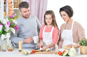 young family cooking together