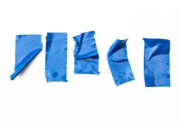 Set of Blue tapes on white background. Torn horizontal and different size blue sticky tape, adhesive pieces.
