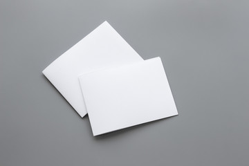 Blank portrait mock-up paper. brochure magazine isolated on gray, changeable background / white paper isolated on gray