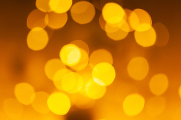Blurred background of colored yellow lights.
