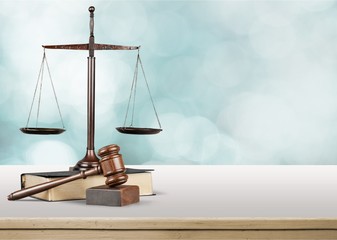 Justice Scales and books and wooden gavel on table. Justice concept