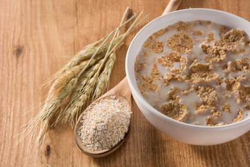 Oats milk and cereals on wooden table. Copyspace