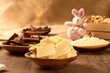 Table with chocolate pieces and Easter decoration