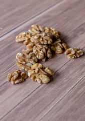 Healthy peeled walnuts and arranged on rustic-looking wood