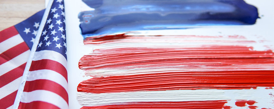 The USA flag painted on white paper with watercolor 