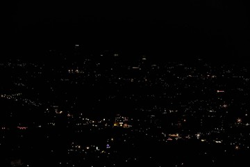 Pilot view over city with nightlights. Beautiful night backgrounds.