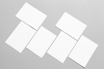 Blank portrait mock-up paper. brochure magazine isolated on gray, changeable background / white paper isolated on gray