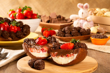 Gourmet easter egg, stuffed with chocolate and strawberry. Easter egg with pudding cream, Easter...