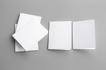 Blank portrait mock-up paper. brochure magazine isolated on gray, changeable background / white paper isolated on gray