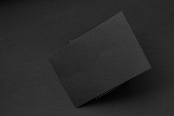 Blank portrait A4. brochure magazine isolated on gray, changeable background / black paper isolated...