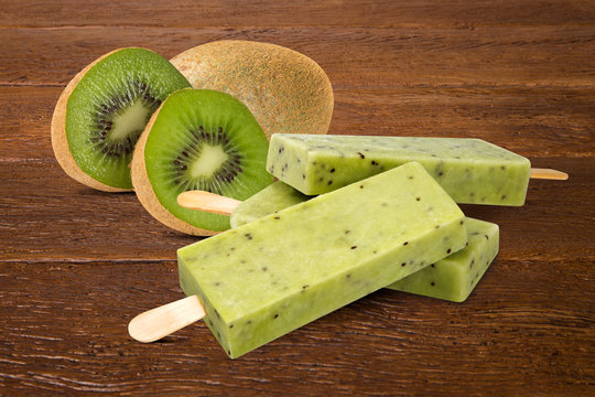 Stick ice cream Swiss chocolate flavor isolated on wood background. Mexican Pallets