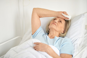 Portrait of a sick senior woman in hospital
