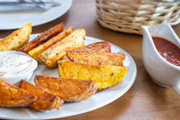 fried potatoes with Mexican sauce on the plate