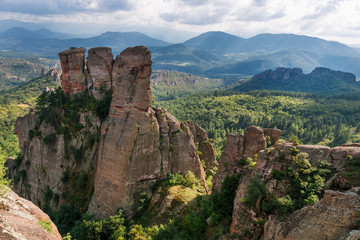 Fototapeta na wymiar Belogradchik rocks during summer, with trees surrounding the stunning rock formations.