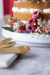White cake Decorated with flower and berries. For celebrate party weddings, birthdays and events.