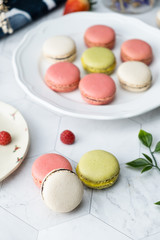 Macaron or French macaroon cookies dessert. Set on cafe table.