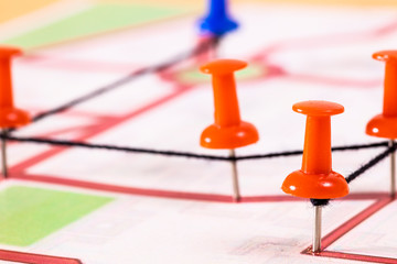 Street map with thumbtacks forming a route
