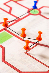 Street map with thumbtacks forming a route