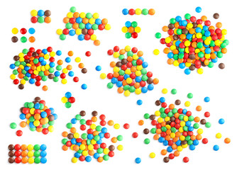 Set of tasty colorful candies on white background