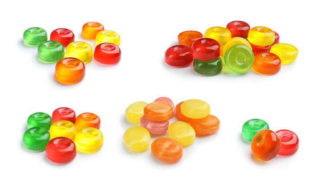 Set of colorful tasty hard candies on white background