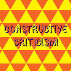 Writing note showing Constructive Criticism. Business concept for process of offering valid and well reasoned opinions Repeat Triangle Tiles Arranged in Orange and Yellow Color Pattern