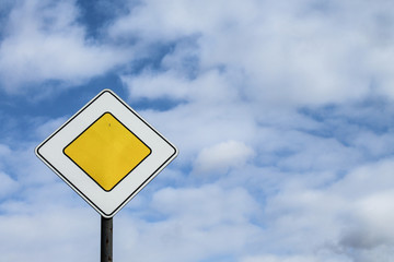 Road sign main road on sky background