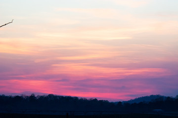 sky and clouds over hills at sunset